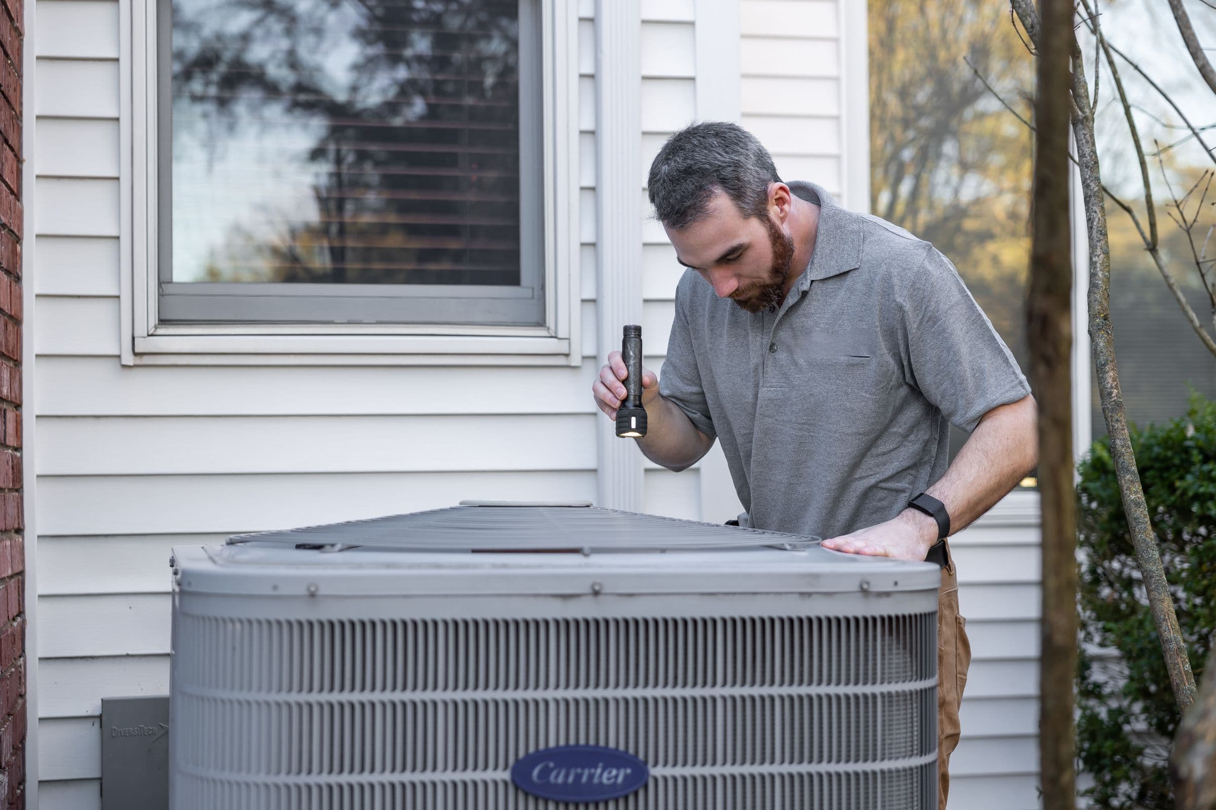 Field technician inspecting outdoor equipment